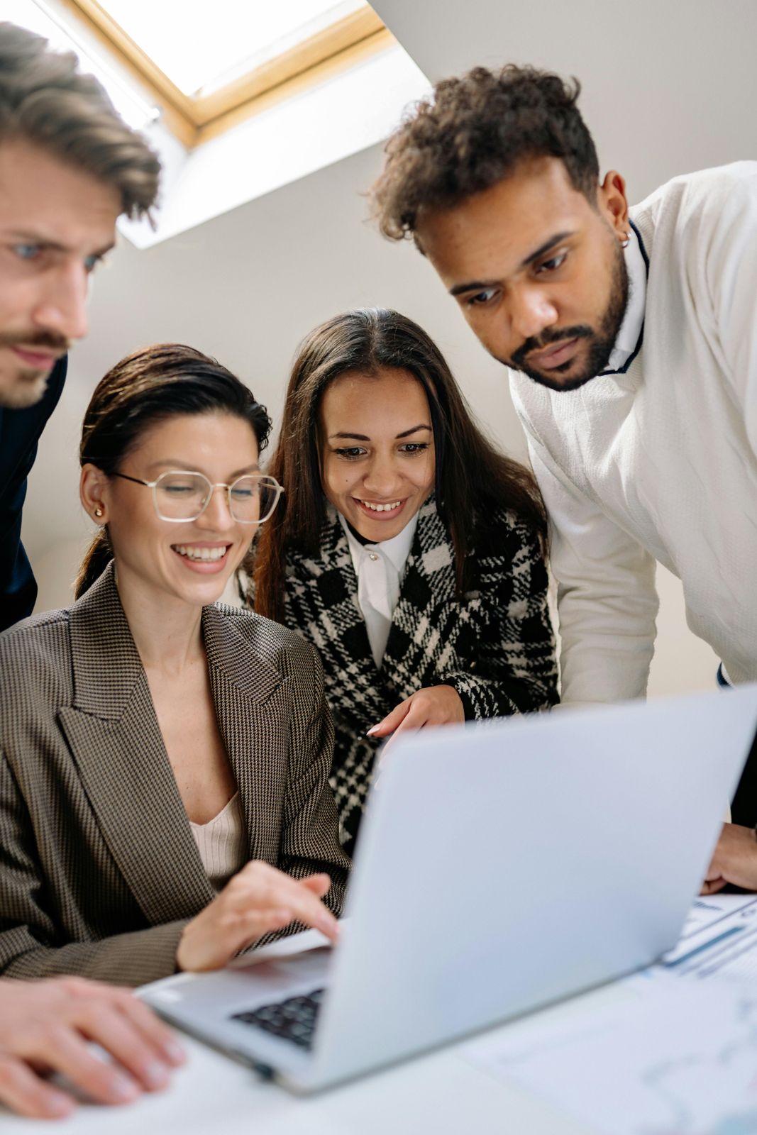 Tax team working together at a laptop